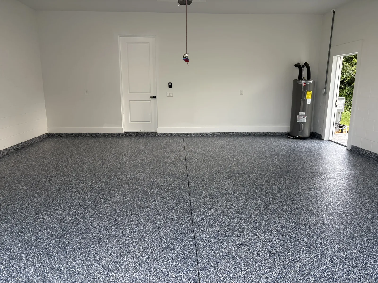 Blue flake epoxy garage floor with painted walls