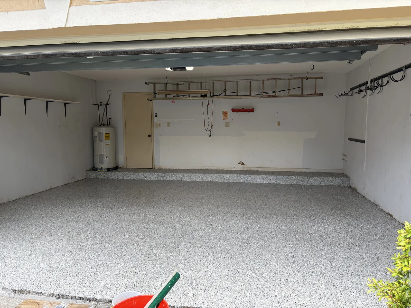 Finished light gray flake epoxy garage floor