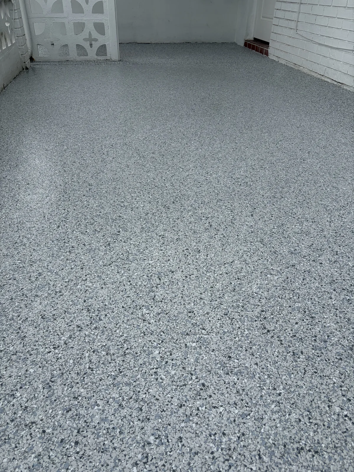 Finished gray flake epoxy patio