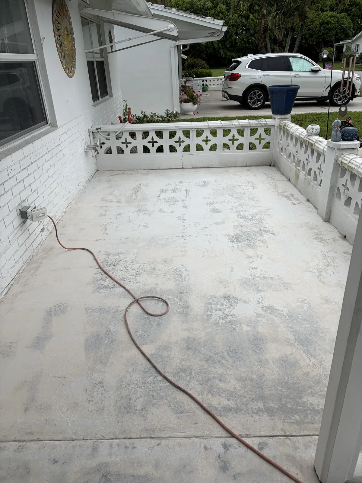 Stained cracked patio before epoxy installation