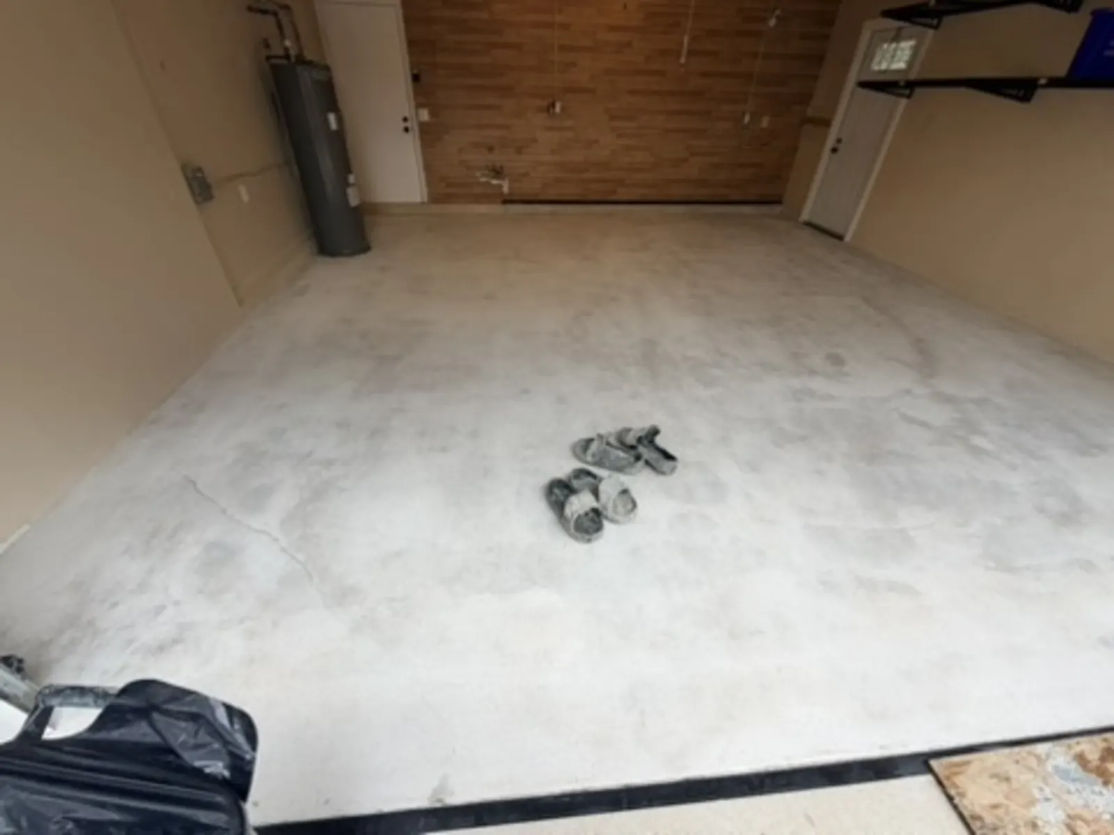 Bare concrete floor ground down and prepped before epoxy coating